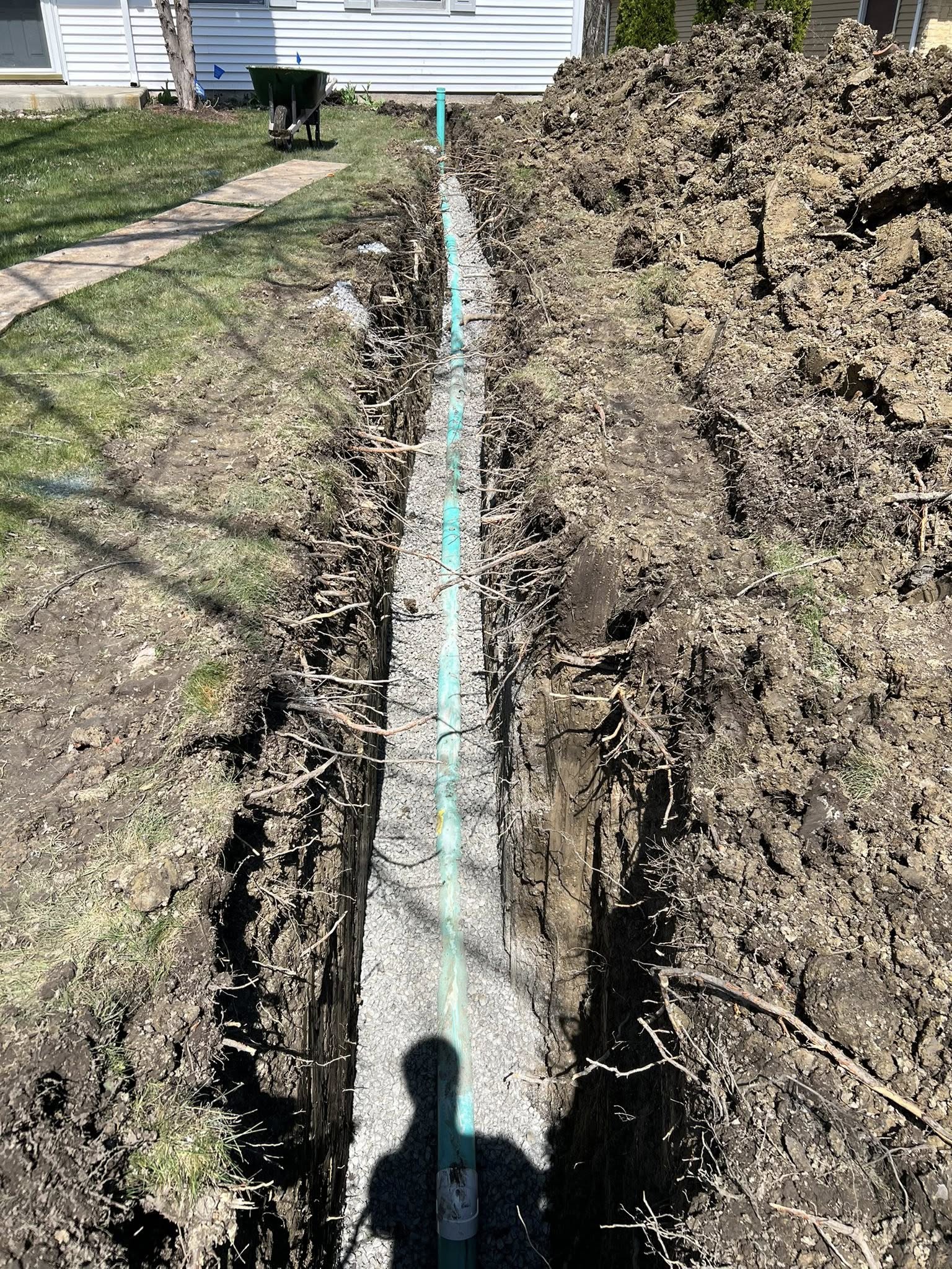 Sewer line replacement with new pipe
